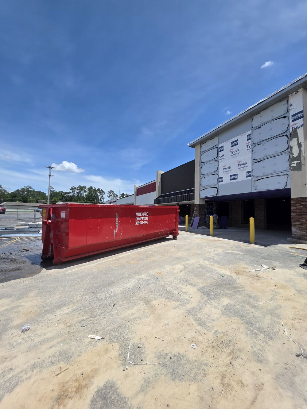 Muckpro dumpster on a commercial construction site