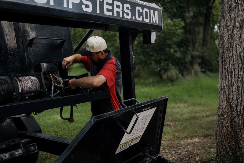 Muckpro hooklift equipment maintenance by hand
